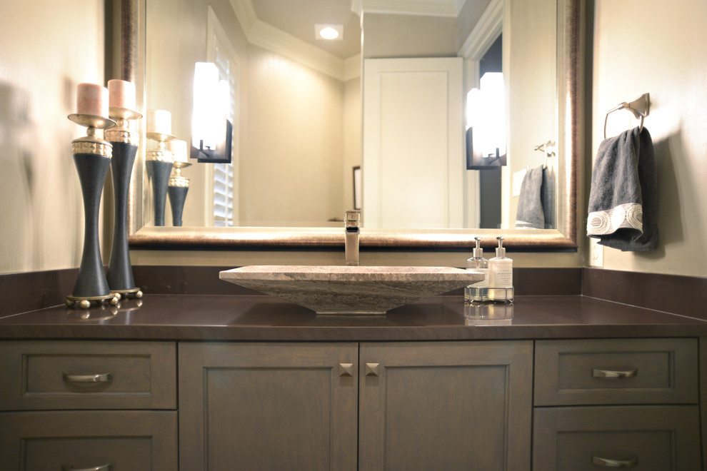 Mid-sized transitional master bathroom in Dallas with recessed-panel cabinets, grey cabinets, a drop-in tub, a shower/bathtub combo, a two-piece toilet, beige walls, dark hardwood floors, a vessel sink and concrete benchtops.