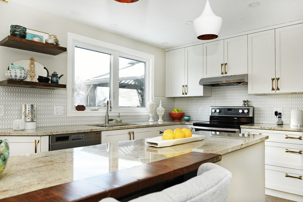 Mid-sized transitional cork floor enclosed kitchen photo in Ottawa with an undermount sink, shaker cabinets, white cabinets, granite countertops, gray backsplash, ceramic backsplash, stainless steel appliances and an island