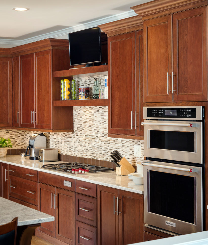 Eat-in kitchen - large transitional l-shaped light wood floor and brown floor eat-in kitchen idea in Atlanta with an undermount sink, flat-panel cabinets, dark wood cabinets, quartz countertops, brown backsplash, stainless steel appliances, an island and matchstick tile backsplash