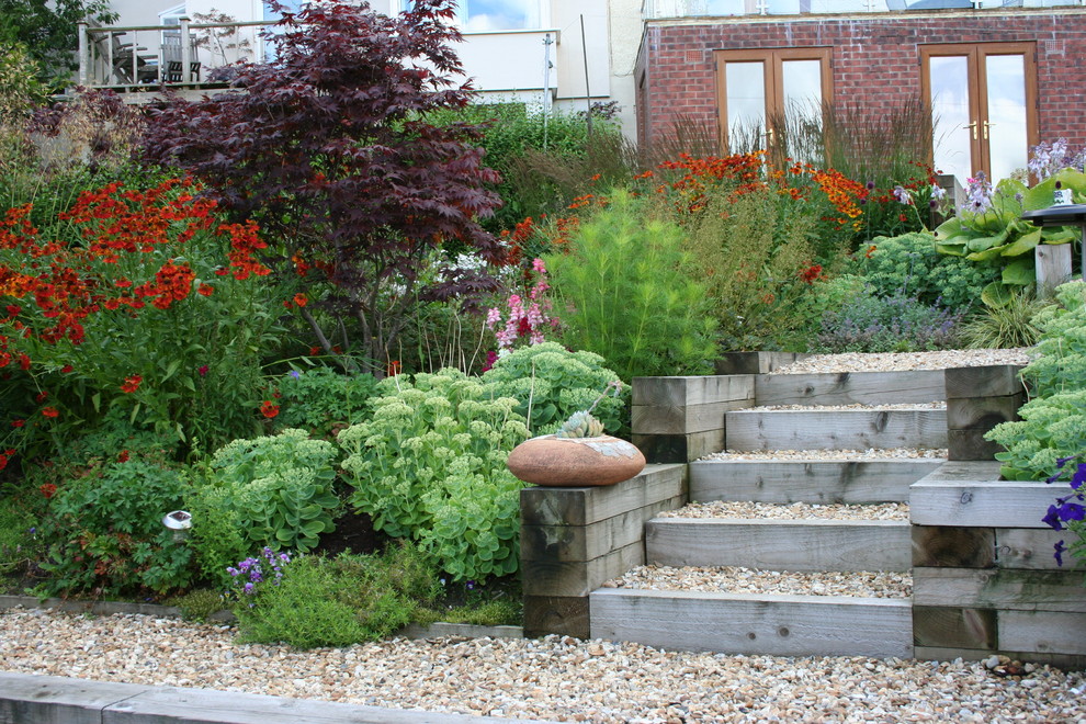 Photo of a beach style garden in Other with gravel.