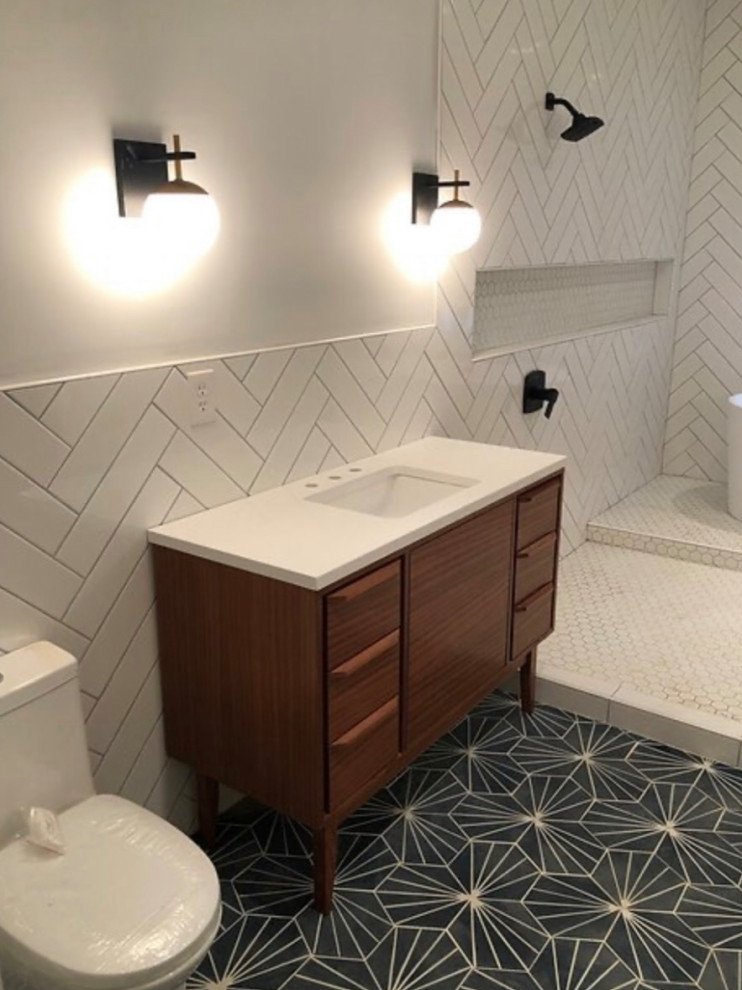 Mid-sized modern master bathroom in Phoenix with recessed-panel cabinets, black cabinets, an open shower, white tile, ceramic tile, an undermount sink, quartzite benchtops, brown floor, an open shower, multi-coloured benchtops, a niche, a single vanity, a freestanding vanity, coffered and panelled walls.