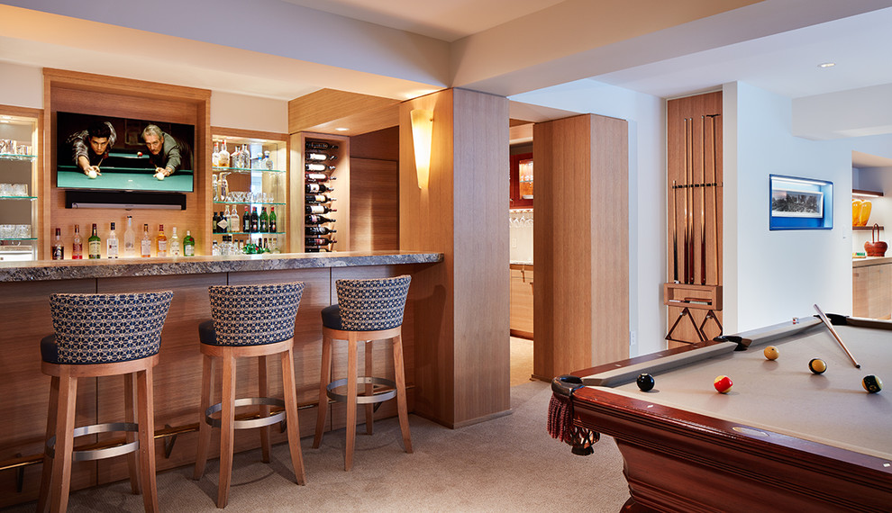 Contemporary u-shaped seated home bar in Minneapolis with carpet.