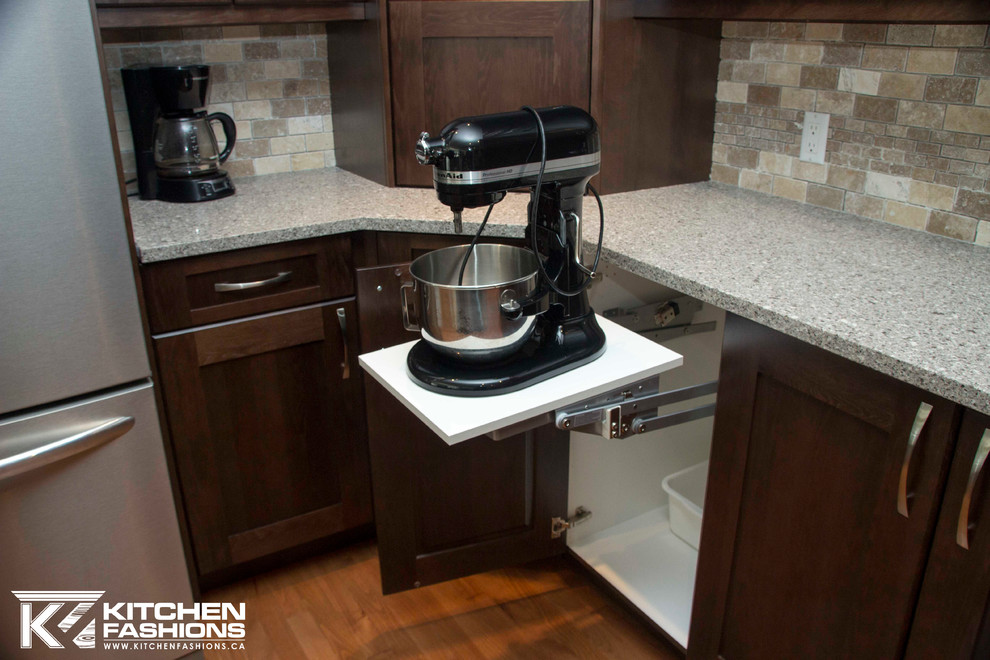 Open concept kitchen - large transitional u-shaped medium tone wood floor open concept kitchen idea with a farmhouse sink, shaker cabinets, dark wood cabinets, quartz countertops, brown backsplash, stone tile backsplash, stainless steel appliances and an island