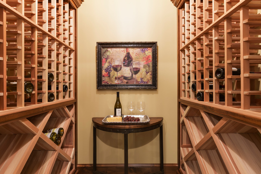 Photo of a transitional wine cellar in Minneapolis with storage racks.
