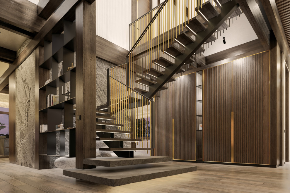 This is an example of a large wood u-shaped metal railing staircase in Moscow with open risers and panelled walls.
