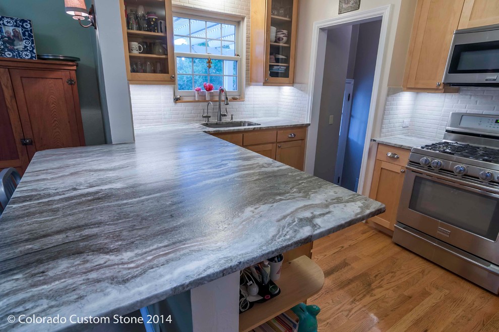 Example of a transitional kitchen design in Denver