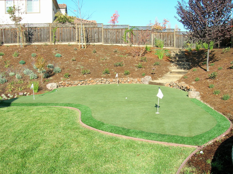 Photo of a large traditional backyard xeriscape in San Francisco with concrete pavers.