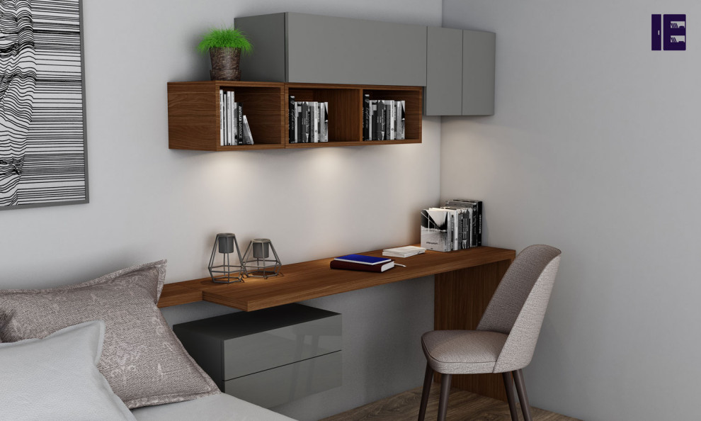 Inspiration for a small modern study in London with a built-in desk and feature lighting.