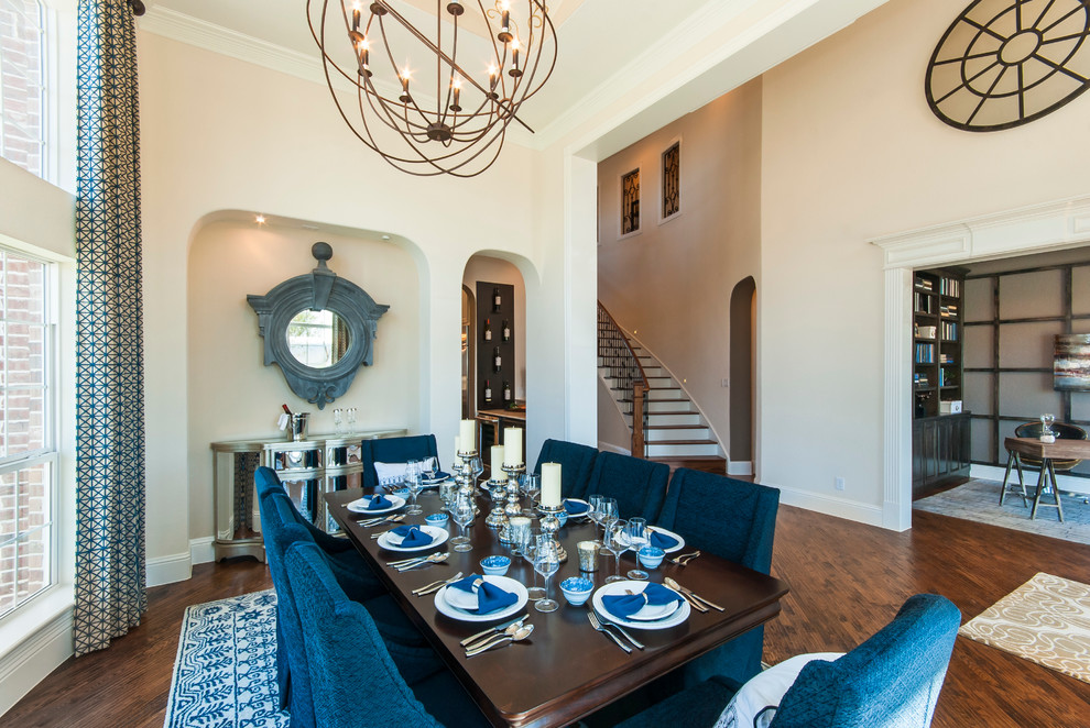 Design ideas for a transitional dining room in Dallas with beige walls and dark hardwood floors.
