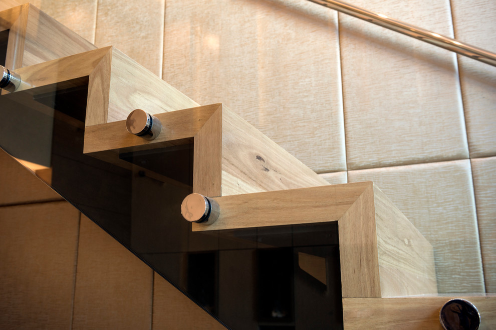 Design ideas for a modern wood l-shaped staircase in Perth with wood risers.