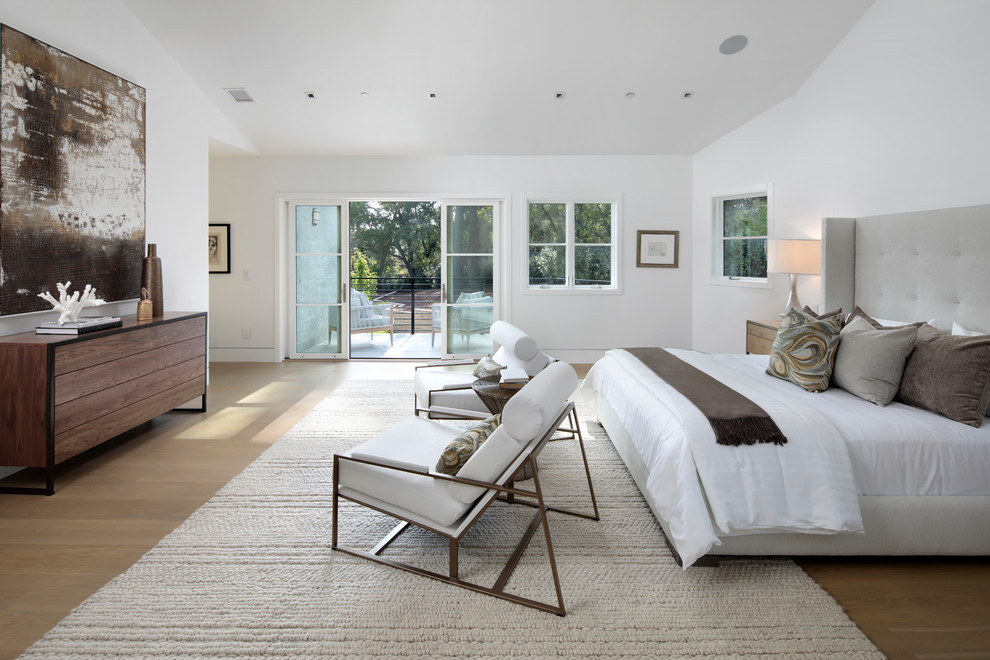 Inspiration for a transitional master bedroom in San Francisco with white walls, medium hardwood floors and brown floor.