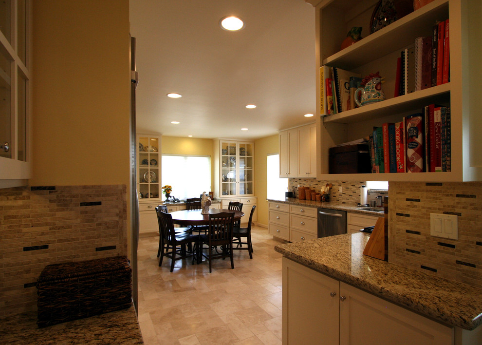 Mid-sized transitional single-wall ceramic tile eat-in kitchen photo with an undermount sink, shaker cabinets, white cabinets, granite countertops, beige backsplash, stone tile backsplash, stainless steel appliances and no island
