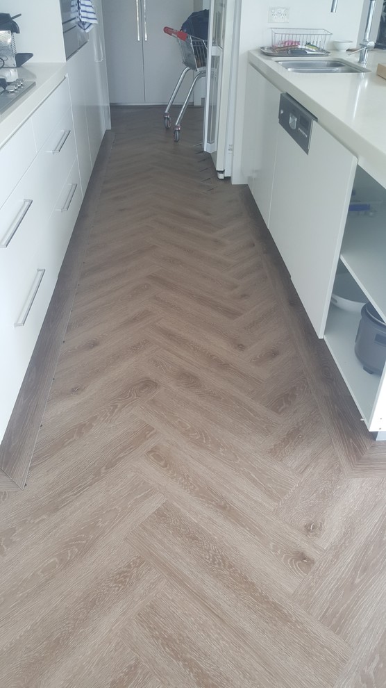 Inspiration for a contemporary kitchen in Gold Coast - Tweed with vinyl floors.