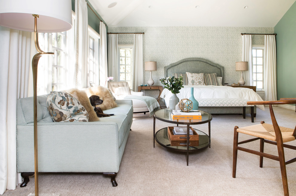 Inspiration for a large transitional master bedroom in Los Angeles with blue walls and carpet.