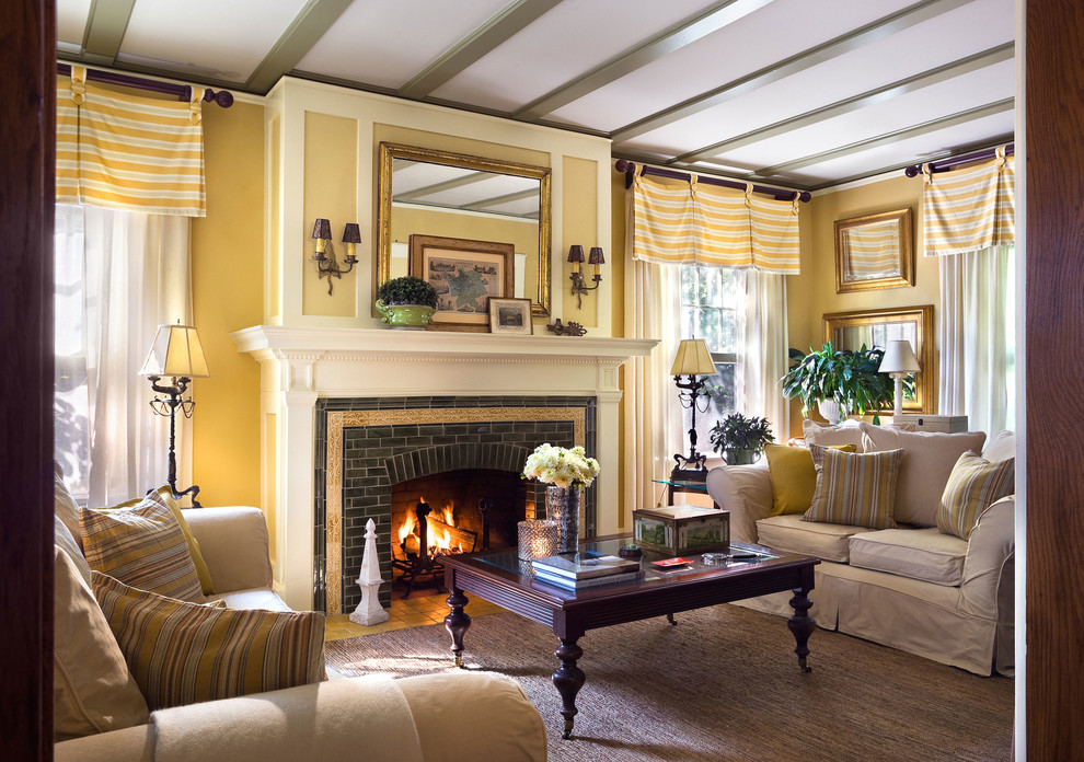 Traditional enclosed living room in New York with yellow walls, a standard fireplace and a brick fireplace surround.