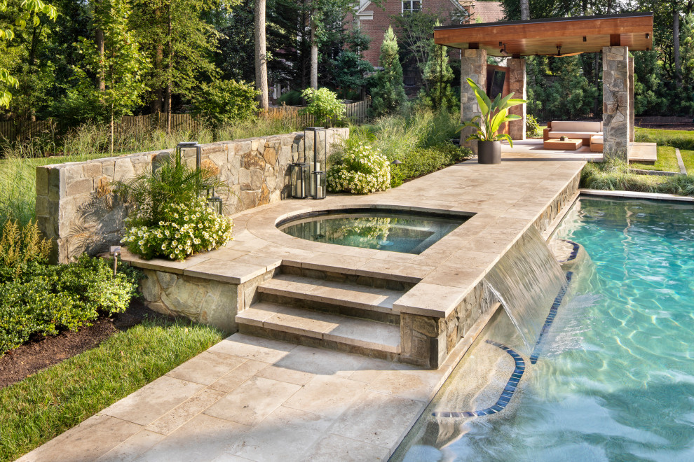 Design ideas for a mid-sized contemporary backyard rectangular pool in DC Metro with a pool house and natural stone pavers.