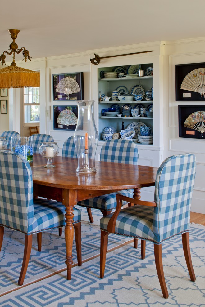 Photo of a traditional separate dining room in Portland Maine with white walls and medium hardwood floors.
