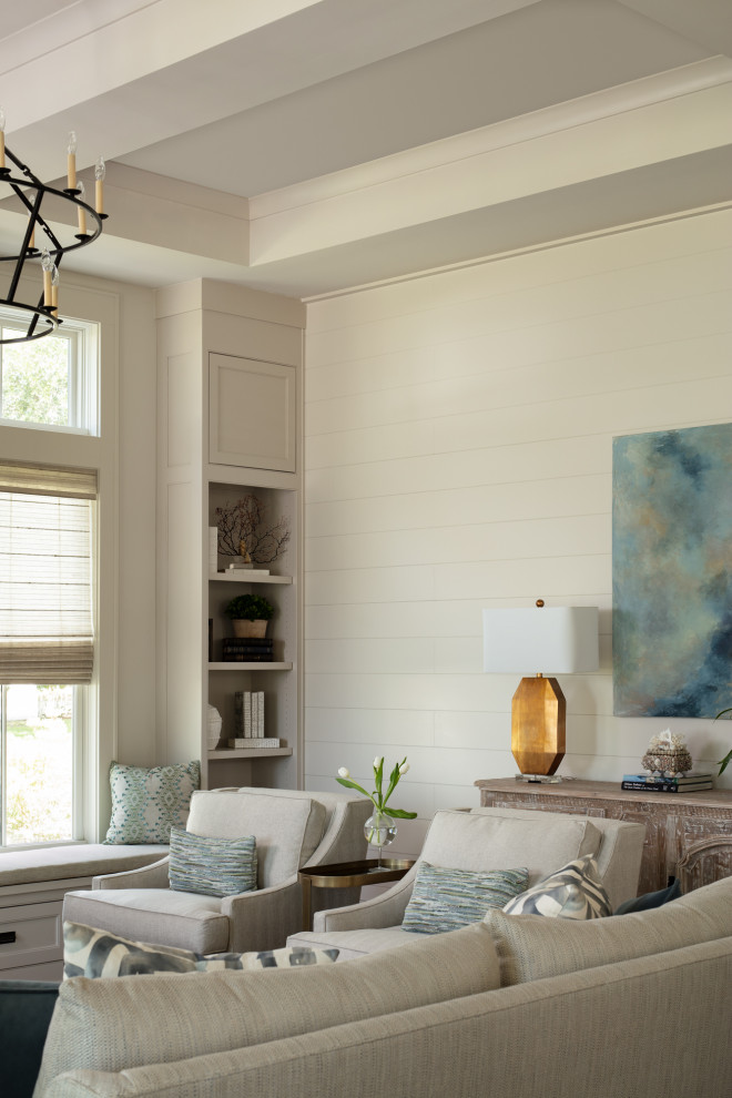 Design ideas for a large coastal open plan living room in Birmingham with beige walls, medium hardwood flooring, a standard fireplace, a plastered fireplace surround, a wall mounted tv, brown floors, a coffered ceiling and tongue and groove walls.
