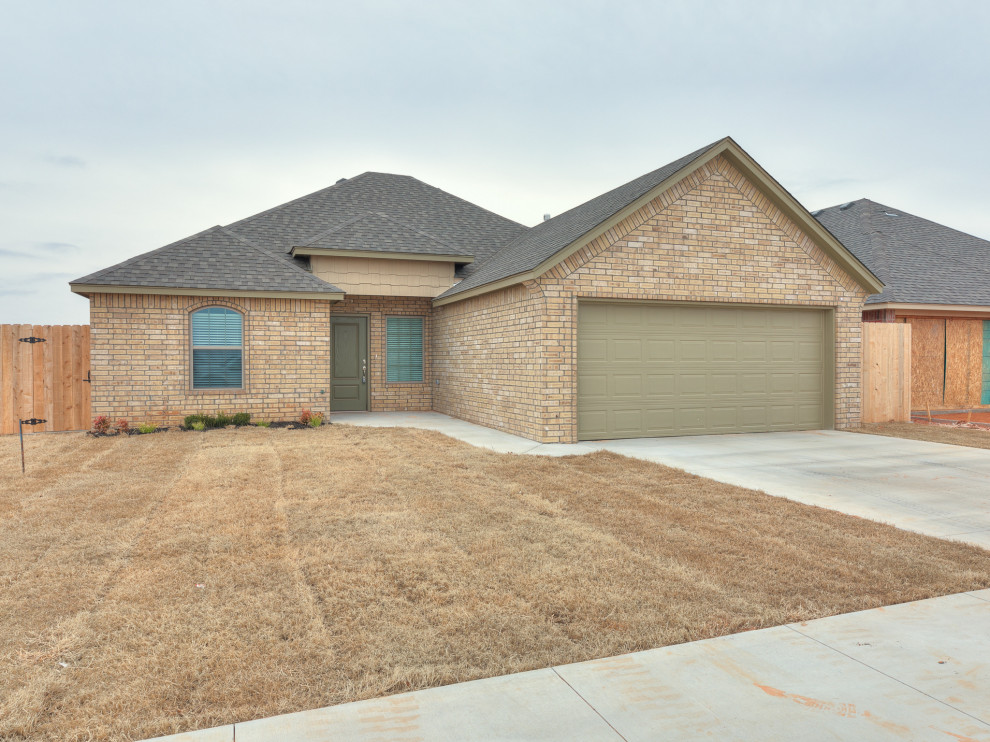 Double car garage brick home