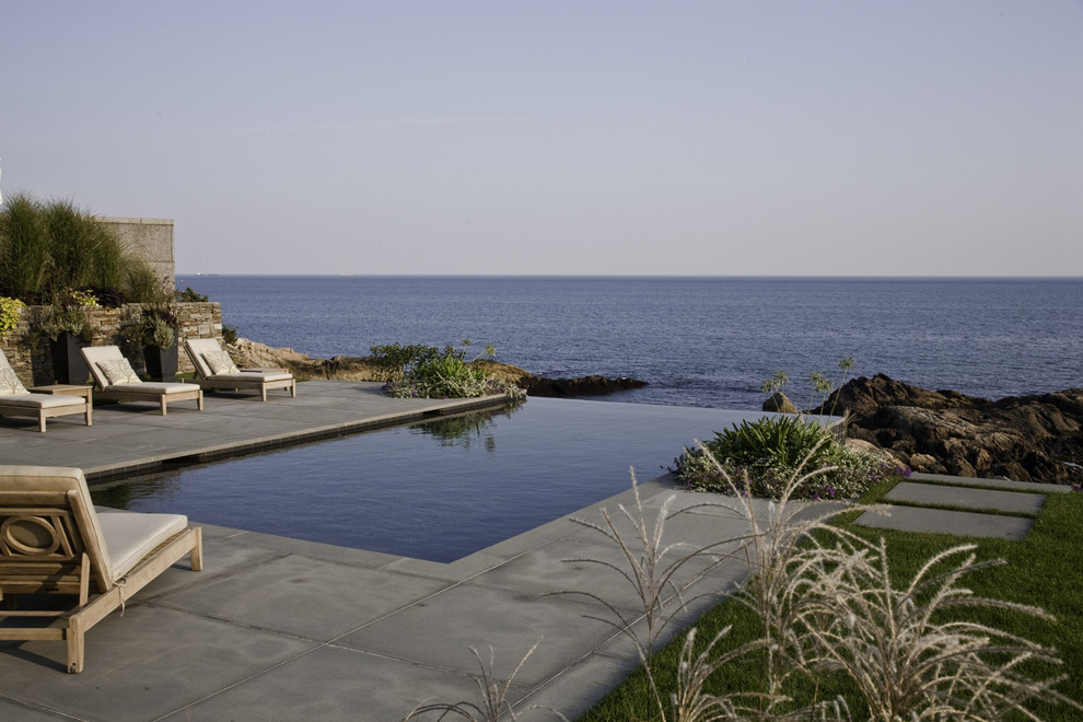 Photo of a beach style infinity pool in Boston.
