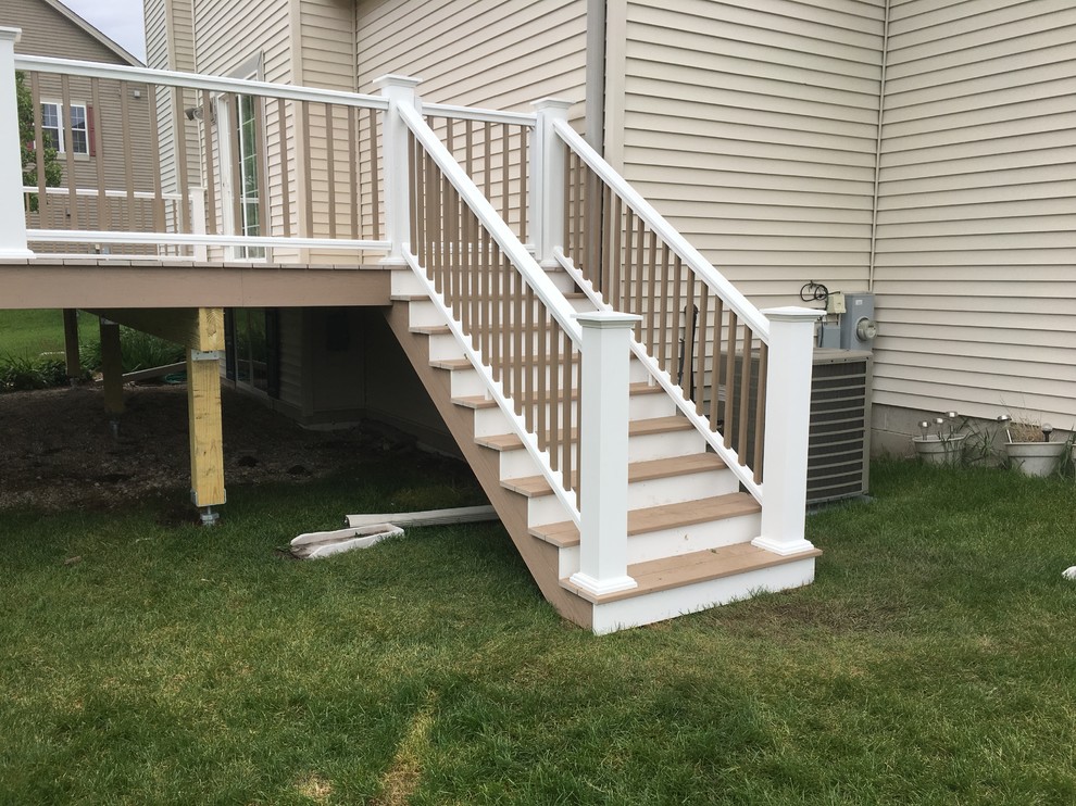 Mid-sized transitional backyard deck photo in Milwaukee with no cover
