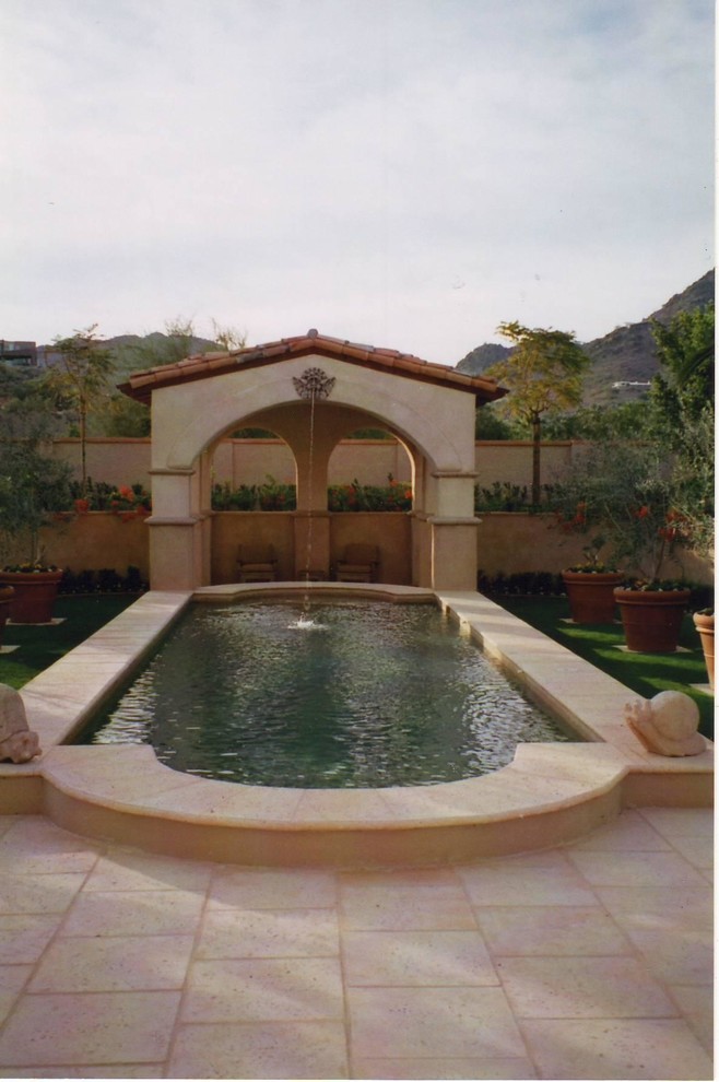 Inspiration for a large backyard concrete paver pool remodel in Phoenix