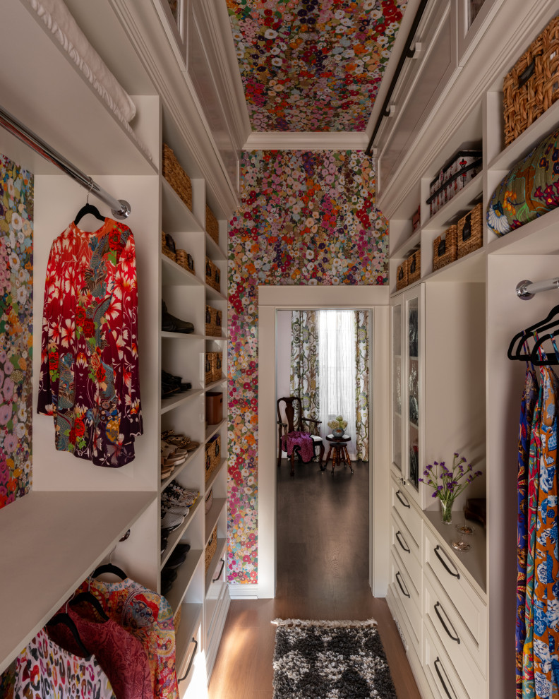 Example of a mid-sized eclectic women's medium tone wood floor and wallpaper ceiling built-in closet design in Seattle with recessed-panel cabinets and white cabinets