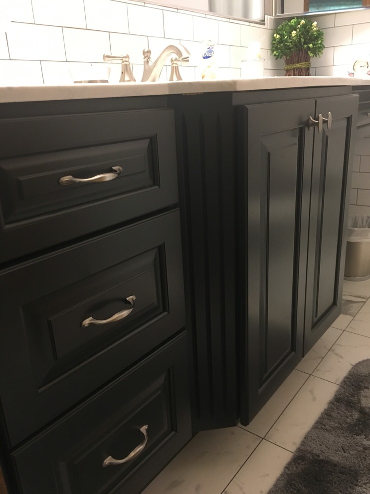 This is an example of a small transitional master bathroom in Chicago with raised-panel cabinets, grey cabinets, an alcove tub, an alcove shower, a two-piece toilet, white tile, ceramic tile, purple walls, porcelain floors, an integrated sink, onyx benchtops, white floor and a shower curtain.