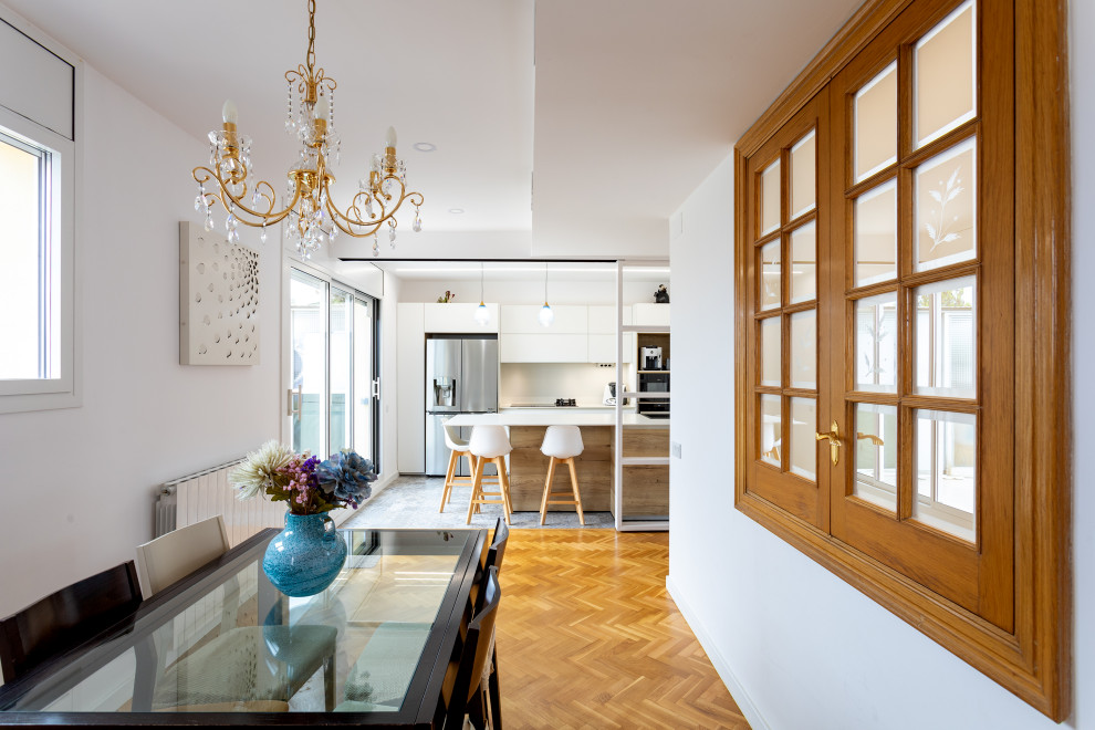 Inspiration for a mid-sized scandinavian u-shaped multicolored floor open concept kitchen remodel in Barcelona with a single-bowl sink, flat-panel cabinets, white cabinets, beige backsplash, stainless steel appliances, a peninsula and beige countertops