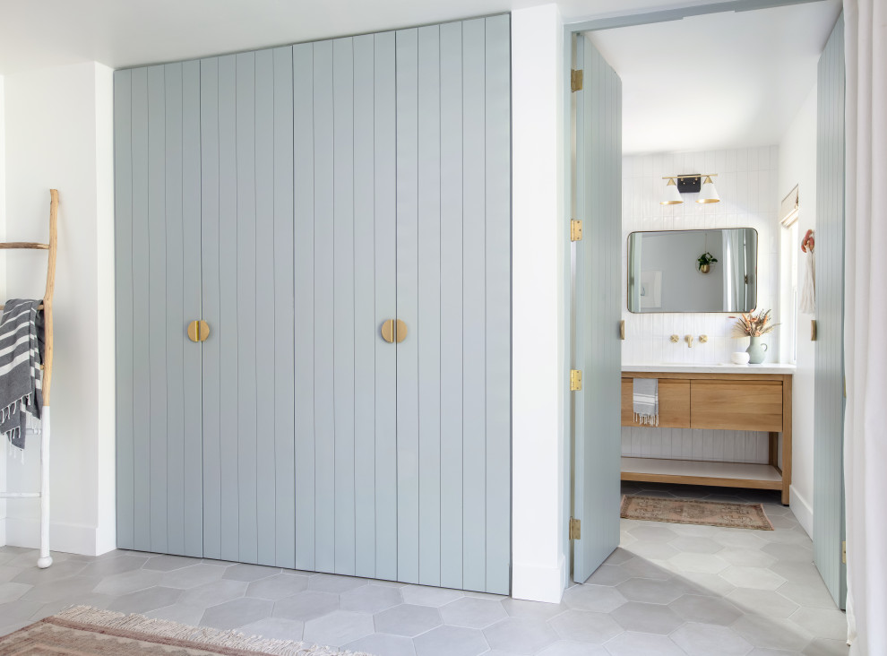 Mid-sized eclectic white tile and ceramic tile gray floor and single-sink bathroom photo in San Diego with blue walls, flat-panel cabinets, light wood cabinets, an undermount sink, quartz countertops, white countertops and a freestanding vanity