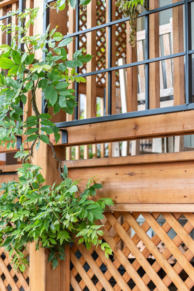 Large mountain style backyard second story wood railing deck photo in San Francisco with no cover