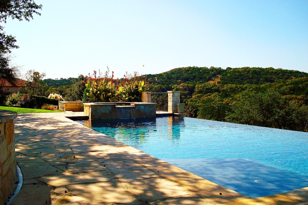 Inspiration for a mid-sized modern backyard custom-shaped pool fountain remodel in Austin