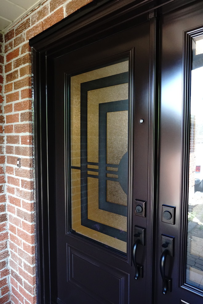 Large transitional front door photo in Toronto with a dark wood front door