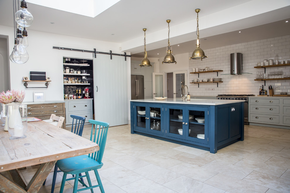 Inspiration for a large contemporary l-shaped eat-in kitchen in Surrey with beaded inset cabinets, blue cabinets, quartzite benchtops, with island and white benchtop.