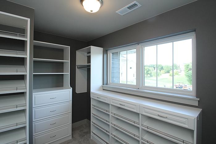 This is an example of a contemporary storage and wardrobe in Cedar Rapids.