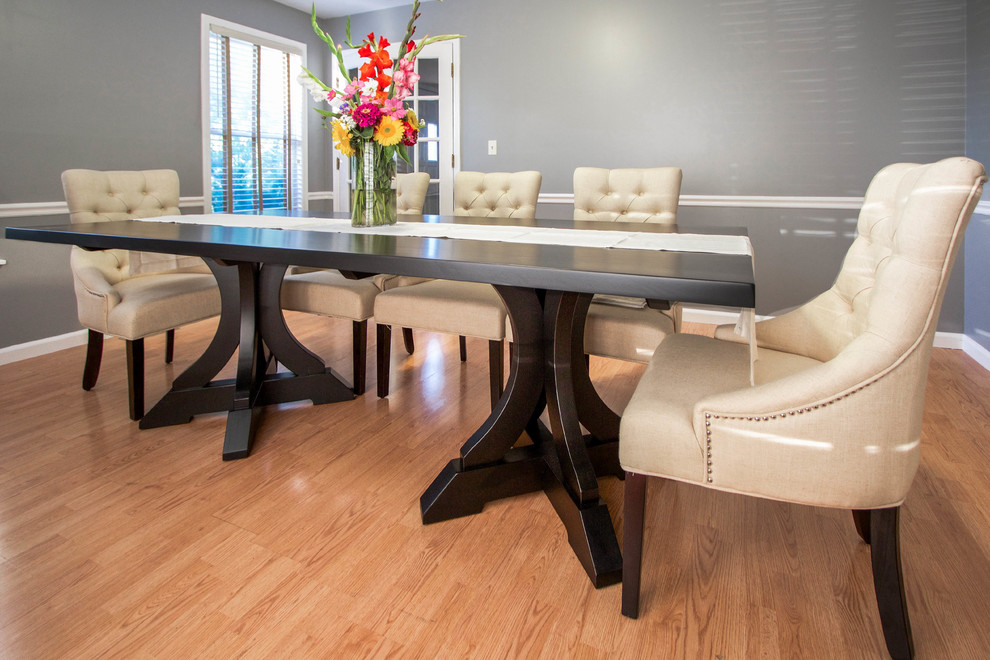 Enclosed dining room - large transitional medium tone wood floor and brown floor enclosed dining room idea in Chicago with gray walls and no fireplace
