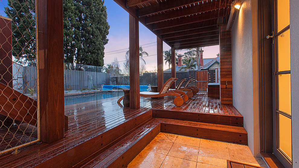 Inspiration for a modern backyard deck in Melbourne with a pergola.