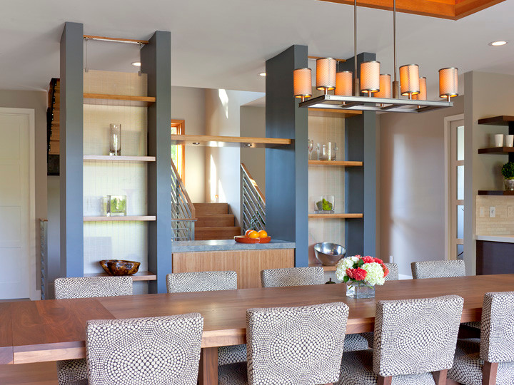 This is an example of a large contemporary open plan dining in San Francisco with beige walls, light hardwood floors, no fireplace and beige floor.