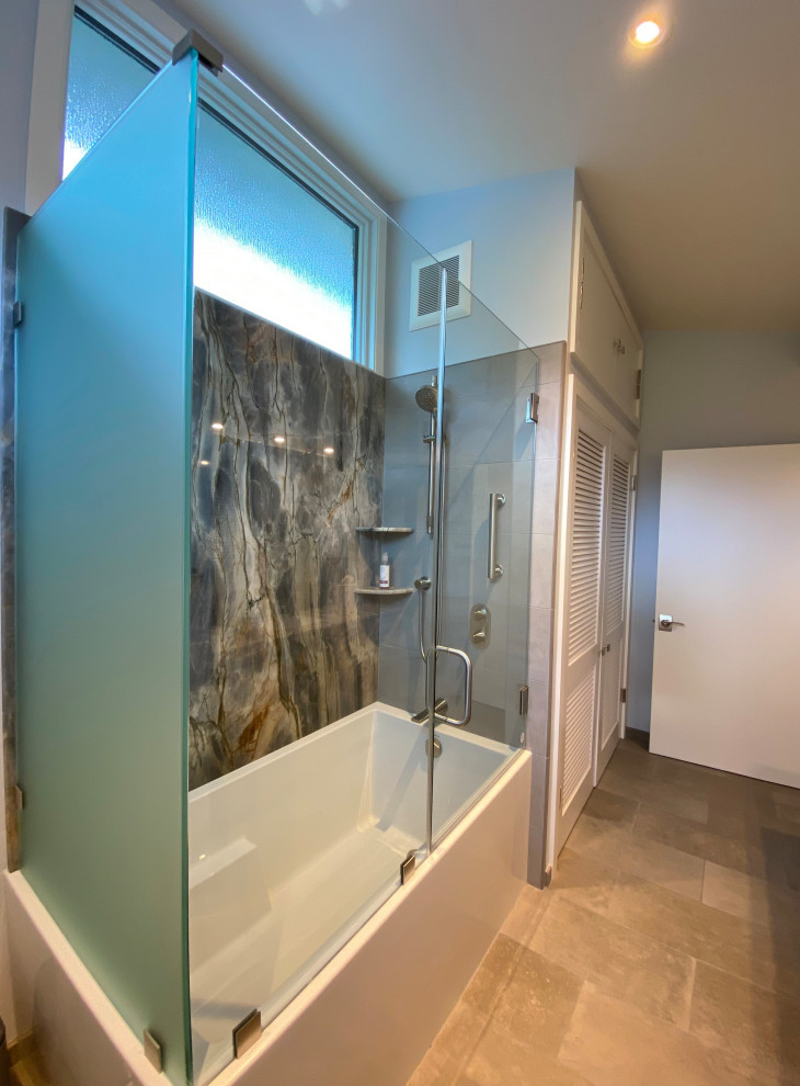 Medium sized bohemian shower room bathroom in San Francisco with flat-panel cabinets, medium wood cabinets, an alcove bath, a shower/bath combination, grey tiles, stone slabs, a submerged sink, granite worktops, grey floors, a hinged door, multi-coloured worktops, a single sink, a built in vanity unit and a vaulted ceiling.