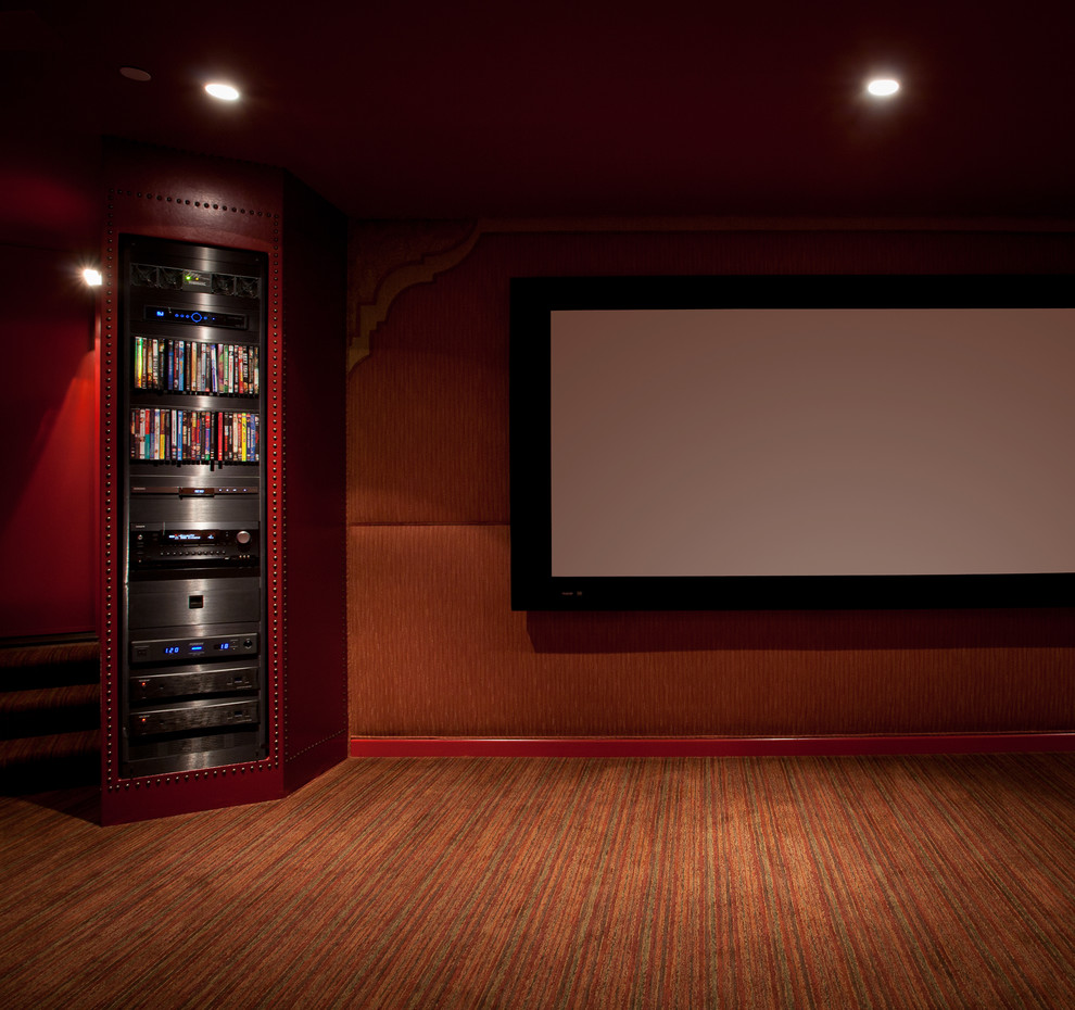 Design ideas for a large mediterranean enclosed home theatre in Los Angeles with orange walls, carpet and a projector screen.