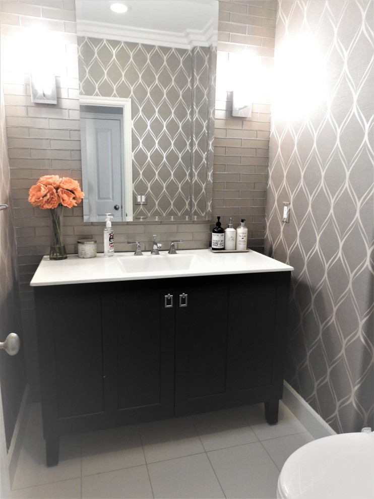 Design ideas for a small contemporary 3/4 bathroom with shaker cabinets, dark wood cabinets, a one-piece toilet, gray tile, glass tile, grey walls, porcelain floors, an integrated sink, marble benchtops, white floor, white benchtops, a single vanity, a freestanding vanity and wallpaper.