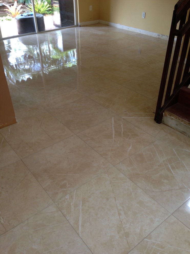 This is an example of a modern living room in Miami with porcelain floors and beige floor.