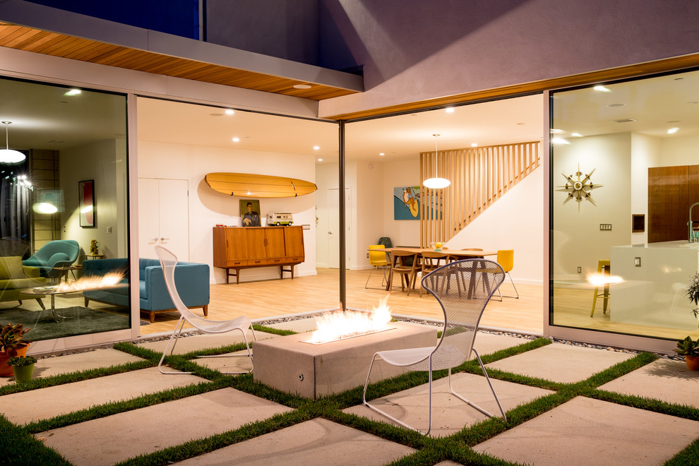 Design ideas for a midcentury patio in San Diego with concrete pavers and a fire feature.