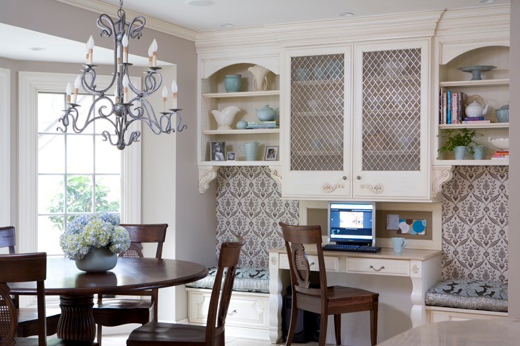 Inspiration for a mid-sized transitional l-shaped travertine floor eat-in kitchen remodel in Chicago with a farmhouse sink, raised-panel cabinets, white backsplash, paneled appliances, an island, white cabinets, quartz countertops and porcelain backsplash