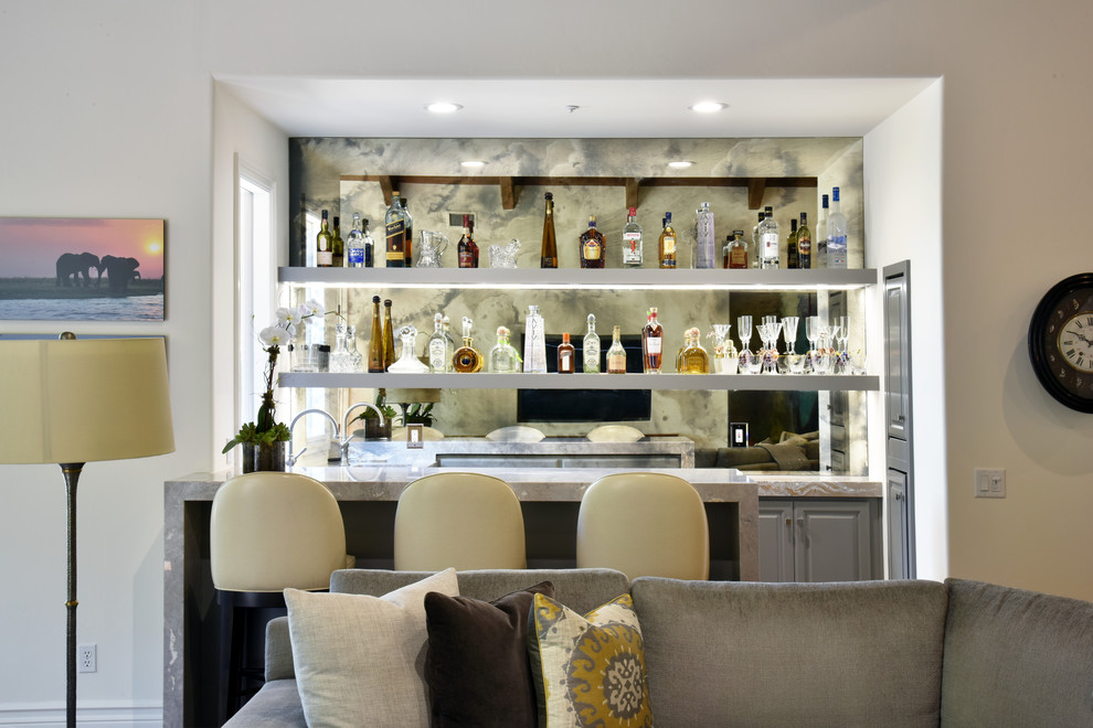 Mid-sized transitional galley seated home bar in San Diego with an undermount sink, shaker cabinets, grey cabinets, marble benchtops, mirror splashback and dark hardwood floors.