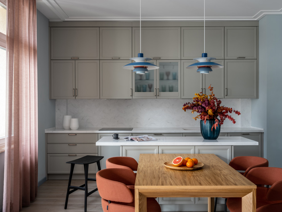 This is an example of a mid-sized scandinavian single-wall eat-in kitchen in Saint Petersburg with white floor, recessed-panel cabinets, grey cabinets, white splashback, with island and white benchtop.