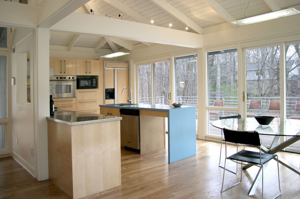 This is an example of a country kitchen in DC Metro with panelled appliances.