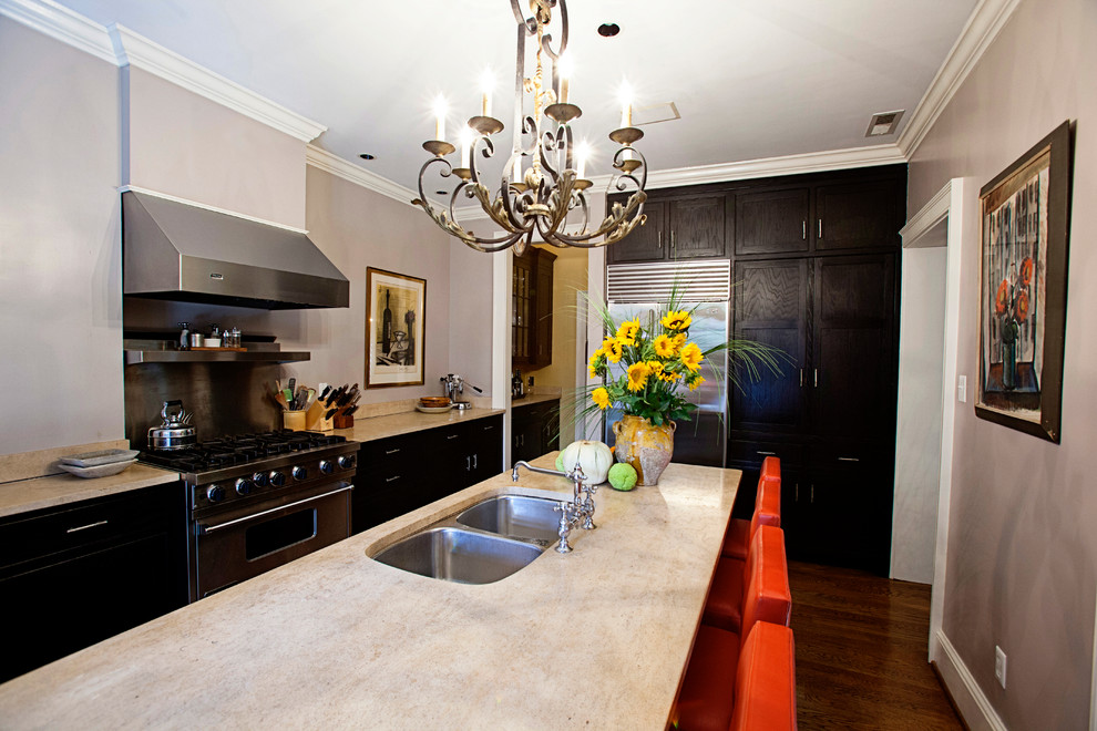 Photo of an eclectic kitchen in Richmond with limestone benchtops.