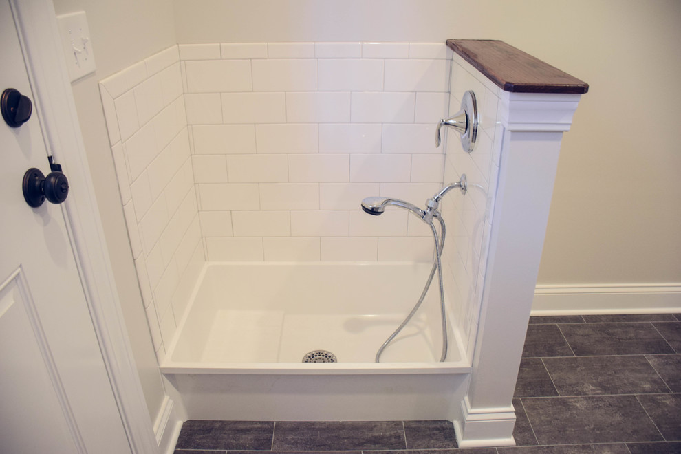 Design ideas for a large country bathroom in Cleveland with shaker cabinets, white cabinets, white walls and ceramic floors.