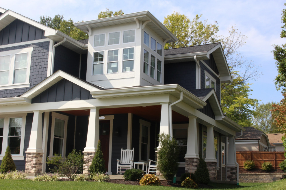 Design ideas for a large country two-storey blue house exterior in St Louis with concrete fiberboard siding.
